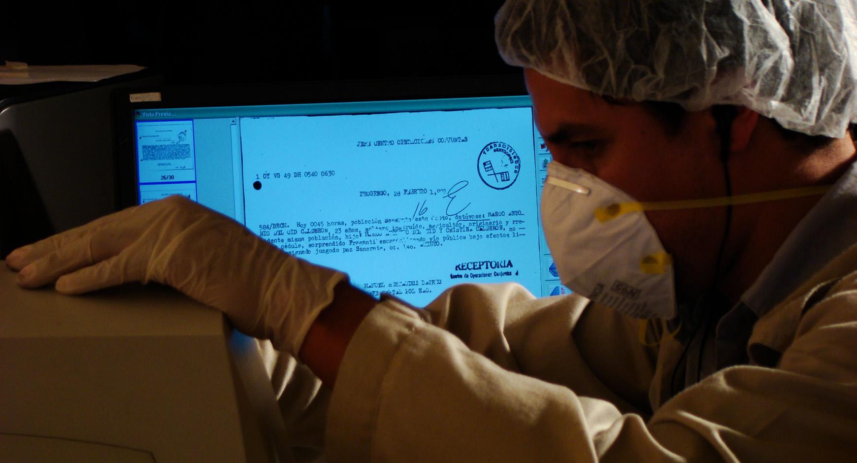 Archivist working in the Guatemalan Police Archive