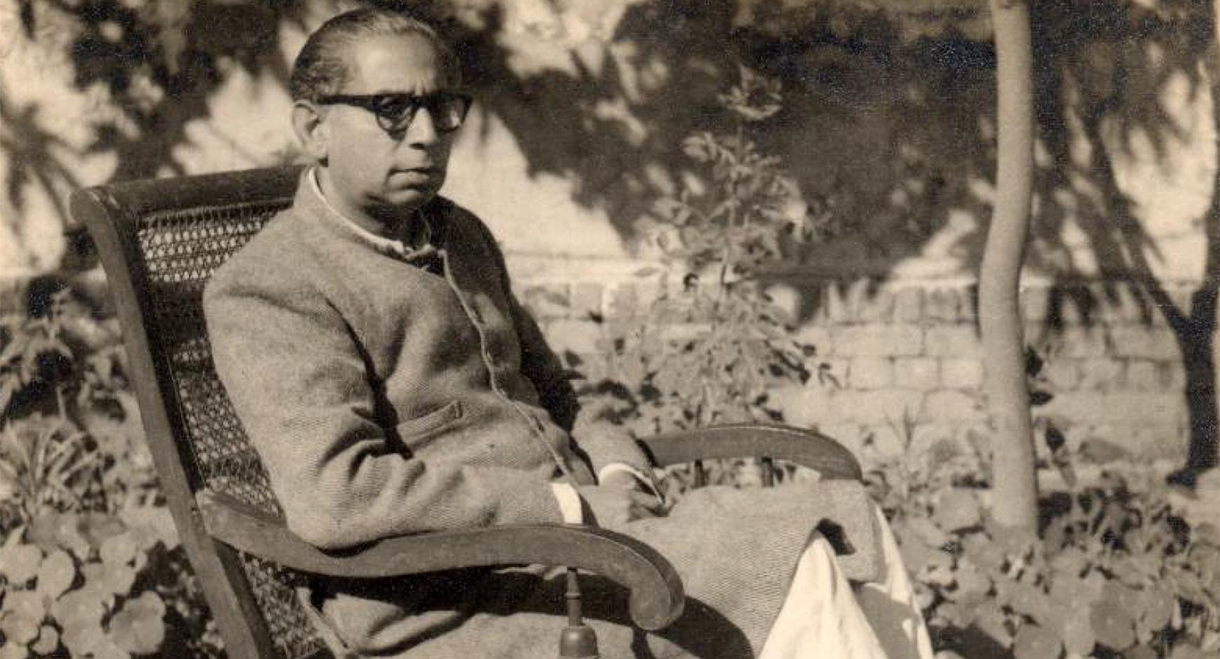 urdu writer sajjad zaheer reclining in chair. black and white.