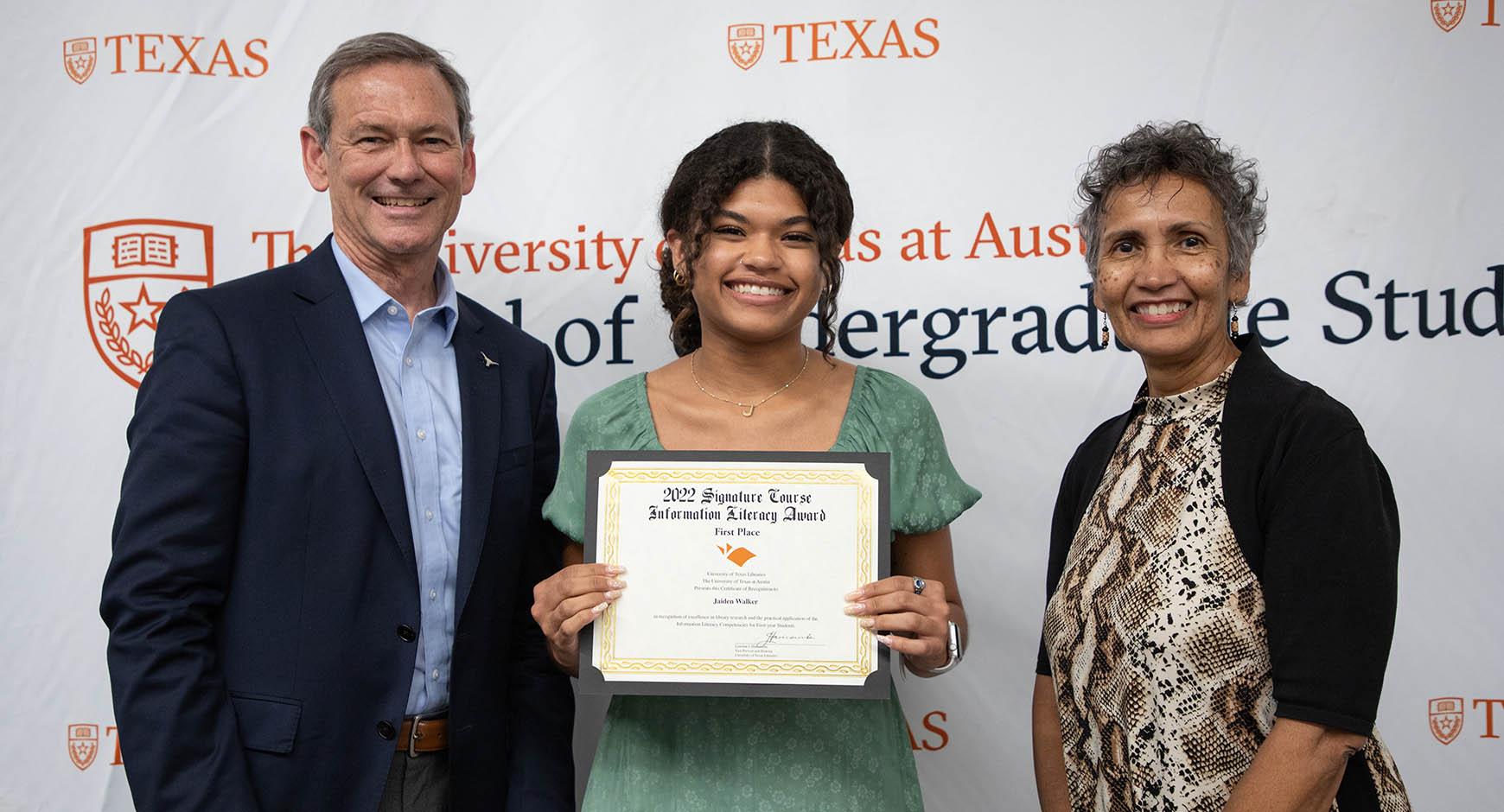 info literacy award winner jaiden walker with undergraduate dean brent iverson and libraries director lorraine haricombe