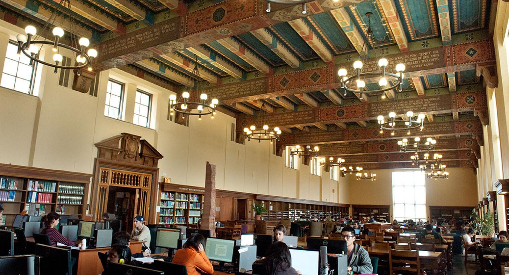 students working in traditional library space at the life science library