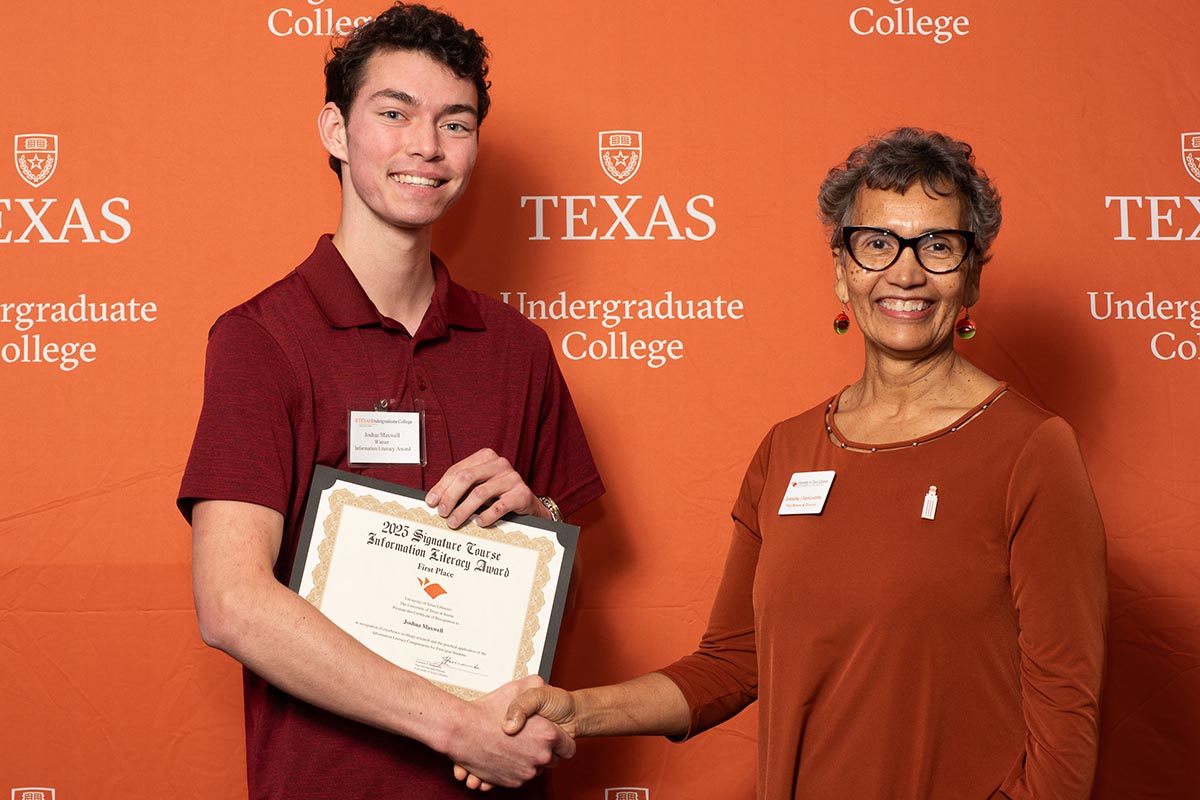 student presented award by library director