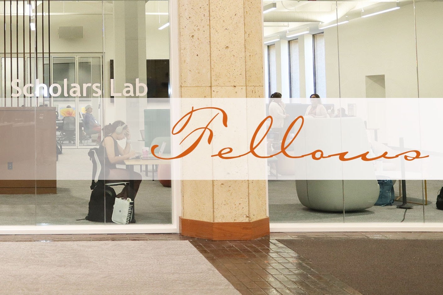 A student with white headphones and a black backpack studies at a table.