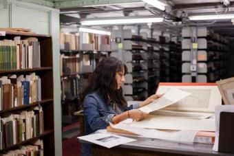 person at a table looking over documents