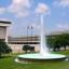 View of the LBJ library fountain with a full pool of water