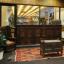 Front door to the Tarlton Library with a throw rug and wooden furniture