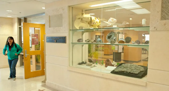 Student outside the Walter Geology Library entrance