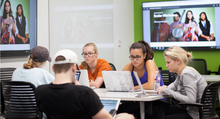 Students collaborating on a project at a table