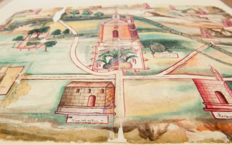 Image is a color drawing of a mission. Bird's eye perspective.